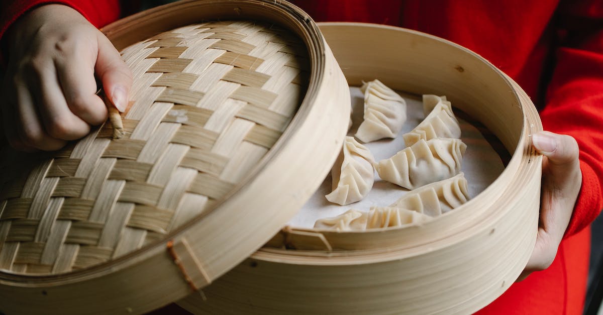 Can't open upgrades menu in MvM - Crop anonymous cook in red clothes opening bamboo steamer with raw delicious dumplings