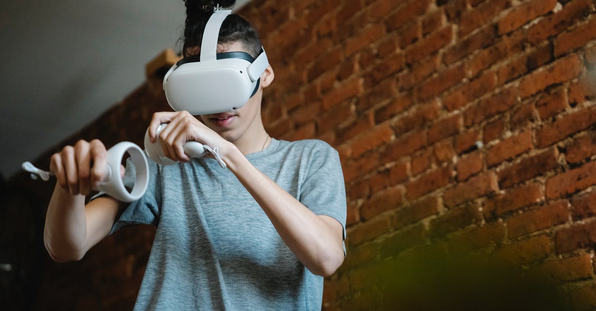 Can't play on the same game - Gamer in VR goggles playing video game in loft house Can't play on the same game - Gamer in VR goggles playing video game in loft house