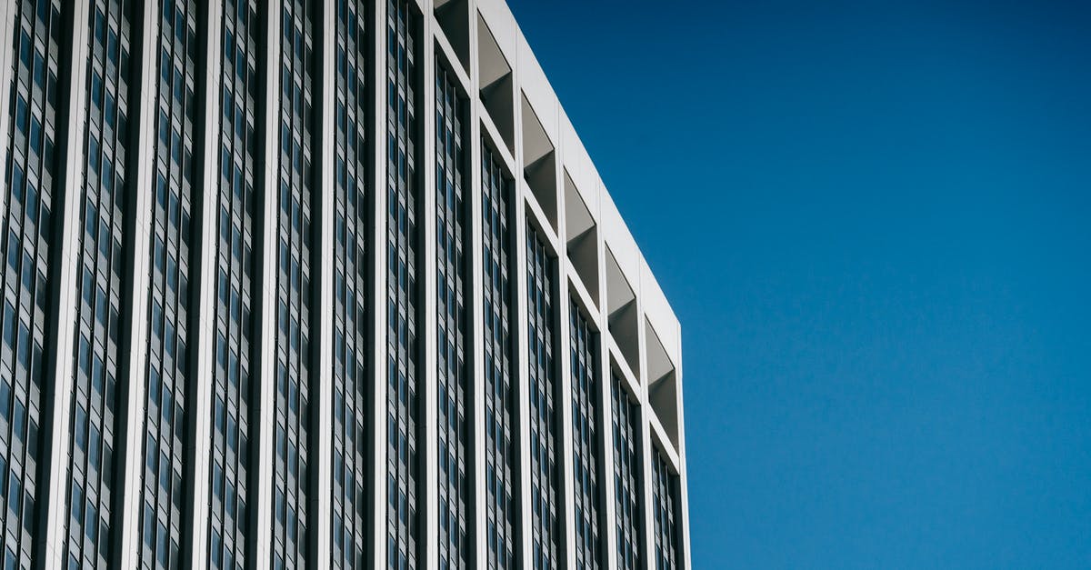 Can't restore my progress on Tiny Tower - Low angle facade of contemporary multistory skyscraper with many windows against blue sky Can't restore my progress on Tiny Tower - Low angle facade of contemporary multistory skyscraper with many windows against blue sky