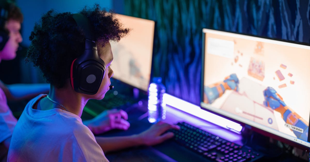 Can't see my mouse pointer while playing full screen on some games - Boy with Black Headphones Playing Computer Game Can't see my mouse pointer while playing full screen on some games - Boy with Black Headphones Playing Computer Game