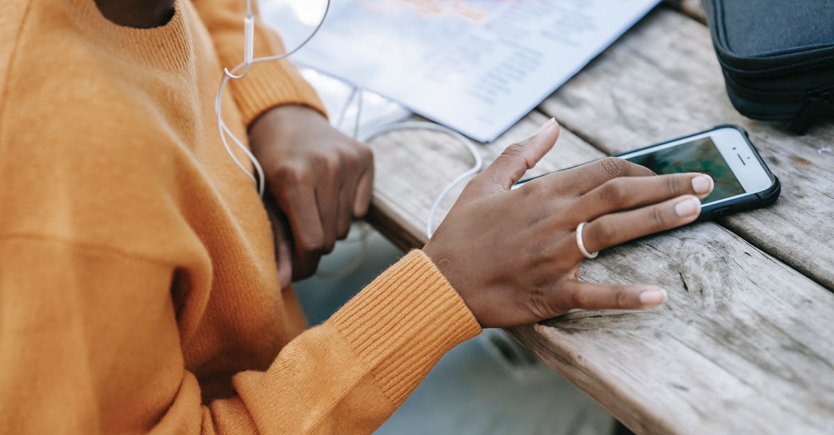 Can't send messages in Twitch Chat - Black woman touching screen of smartphone at table Can't send messages in Twitch Chat - Black woman touching screen of smartphone at table