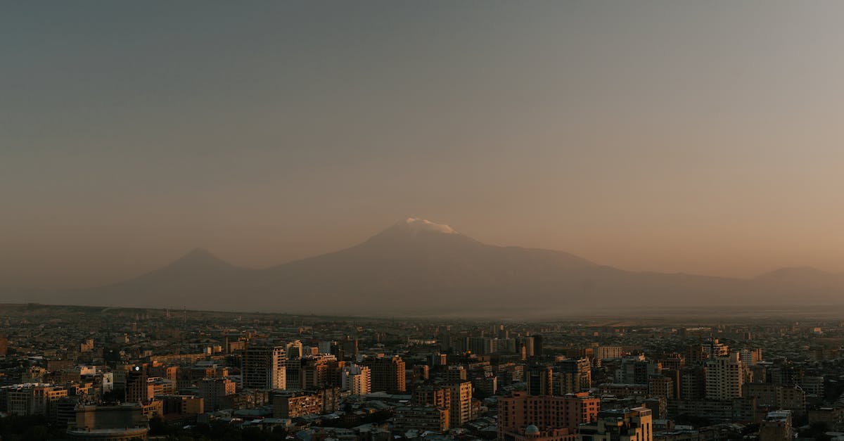 Can't take capital even with casus belli - From above of high towers located in city against high rocky top in evening Can't take capital even with casus belli - From above of high towers located in city against high rocky top in evening