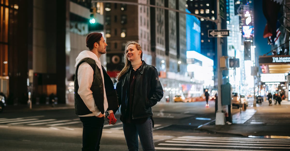 Can 'The Beloved Farmer' achievement be obtained even if you're married? - Cheerful couple standing on crosswalk at night time