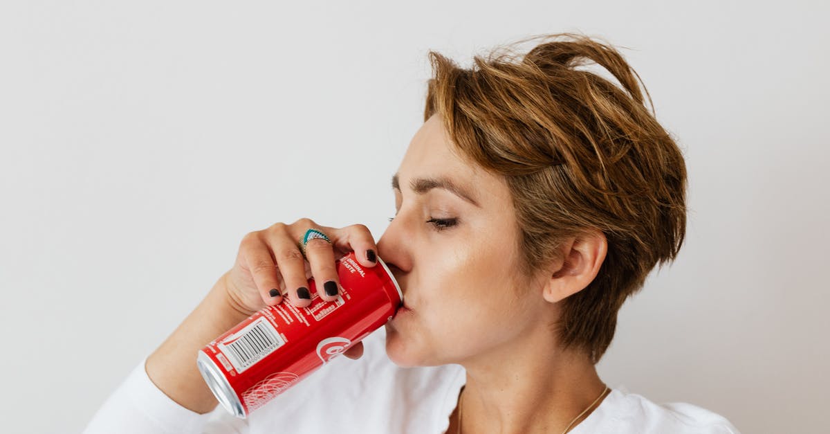 Can a player in the wall get injured? - Thirsty woman enjoying coke from colorful can