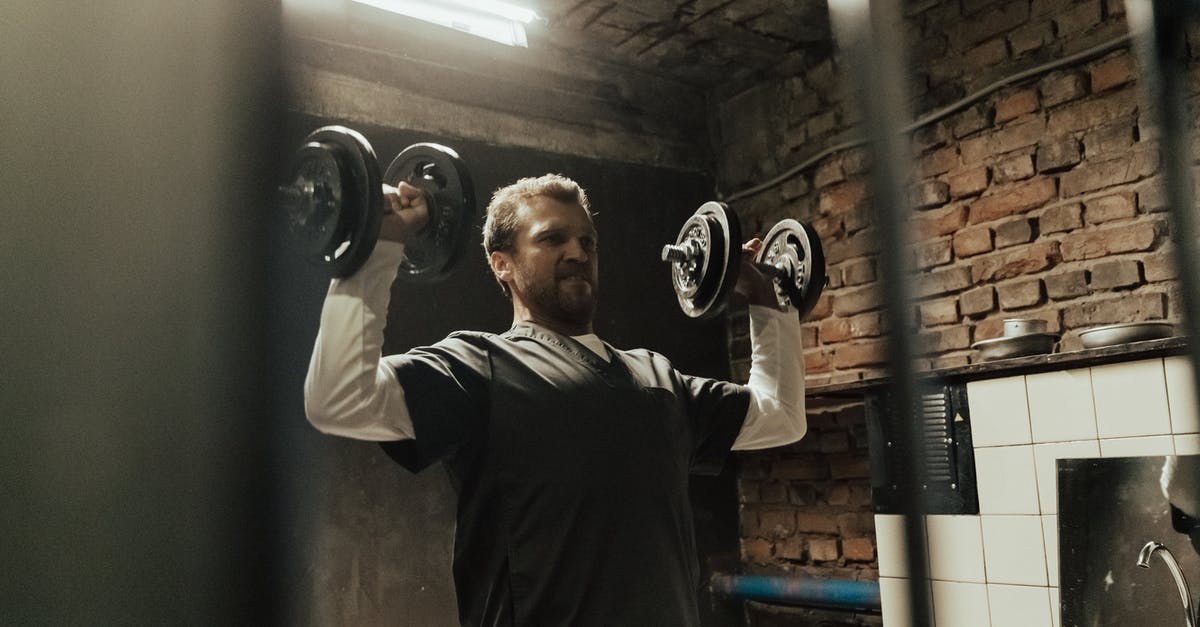 Can a prisoner leave a gang? If so, How? - Man in Gray Crew Neck T-shirt Holding Black Kettle Bell