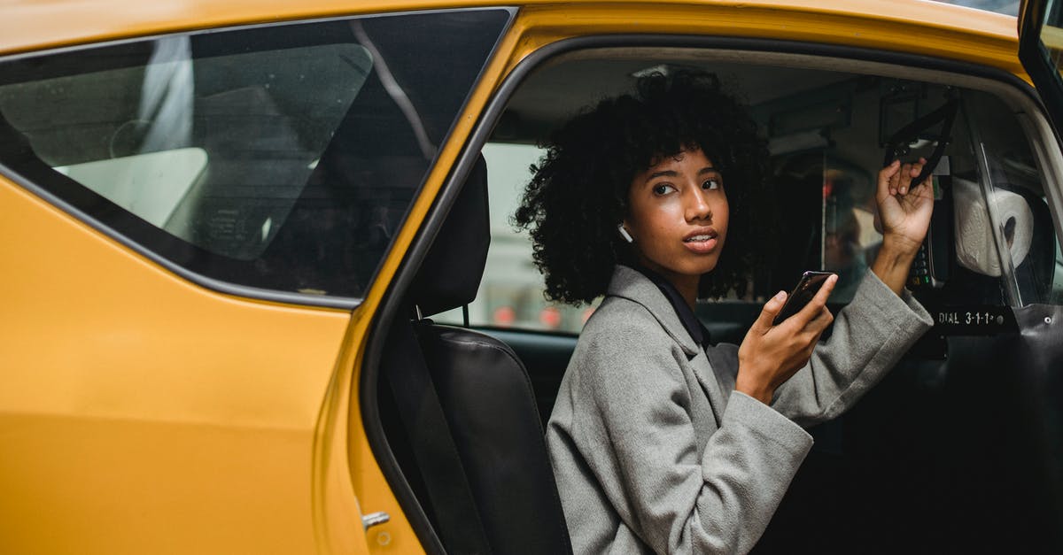 can a trading destination city ever get any yields? - African American woman getting out of yellow cab
