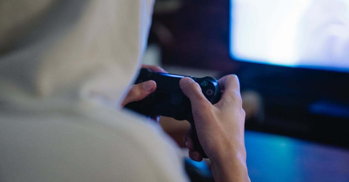 Can a Wii-U gamepad be used as the screen for multiple players? - Crop gamer with joystick playing video game against monitor Can a Wii-U gamepad be used as the screen for multiple players? - Crop gamer with joystick playing video game against monitor