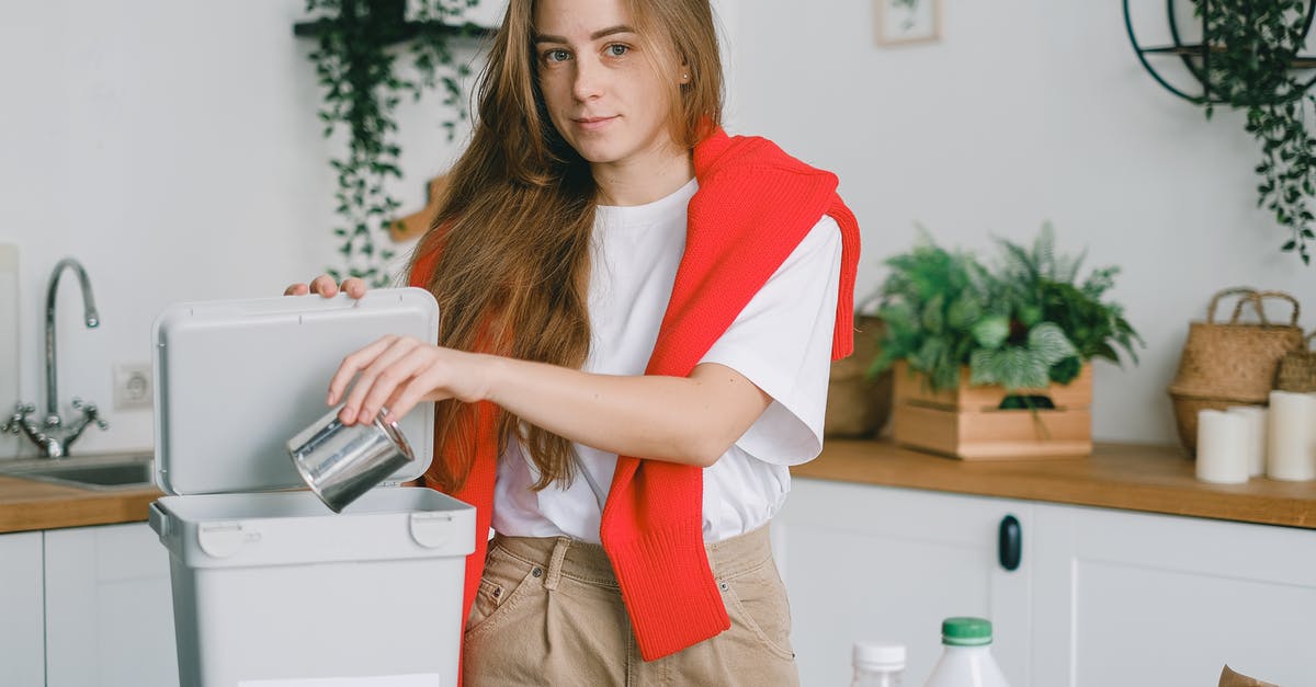 Can AI utilize the mods? - Responsible female sorting garbage while putting tin can into container for metal litter and looking at camera Can AI utilize the mods? - Responsible female sorting garbage while putting tin can into container for metal litter and looking at camera