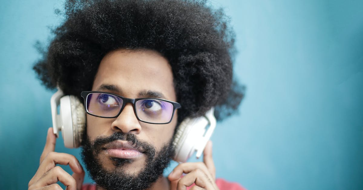 Can Bluetooth headphones be used on a PS3? - Man in Black Framed Eyeglasses Wearing Headphones Can Bluetooth headphones be used on a PS3? - Man in Black Framed Eyeglasses Wearing Headphones
