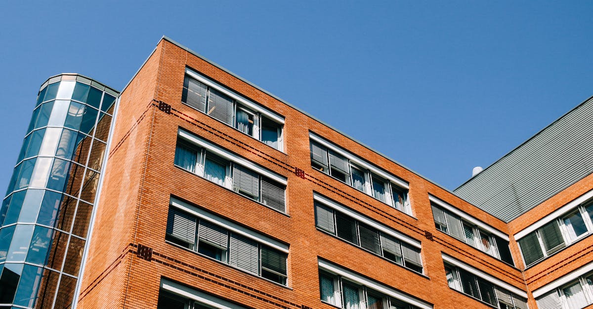 Can command blocks look for a block in an area - From below of contemporary high apartment building located in residential district against blue sky