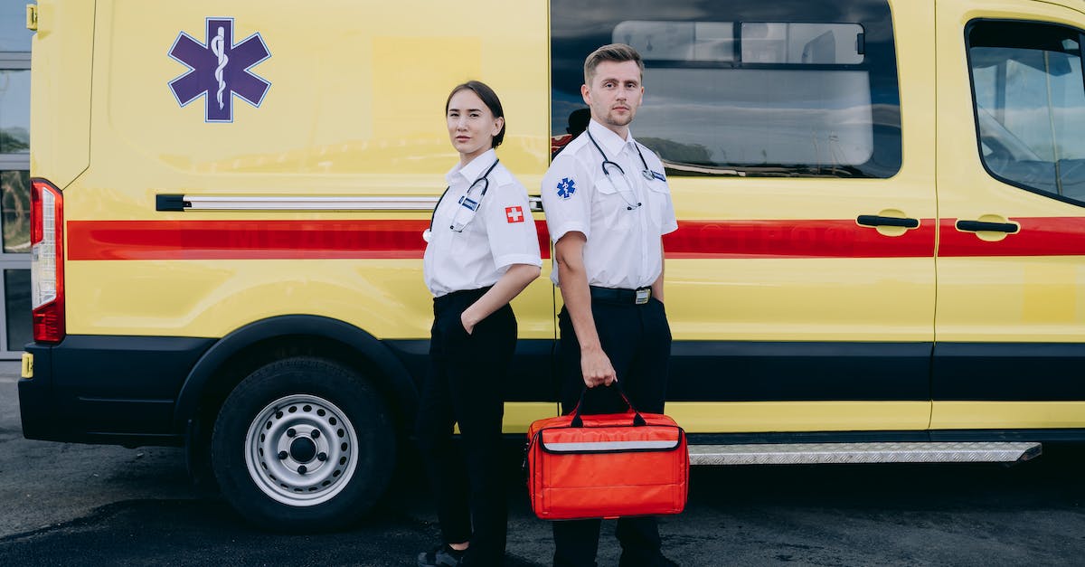 Can Engi Med-bot Dispersal and Emergency Respirators together cancel health loss in vacuum? - Paramedics Standing Beside an Ambulance