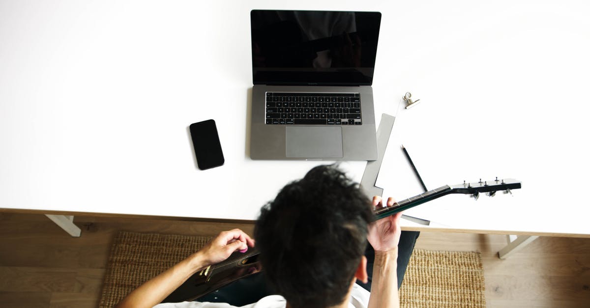 Can Guitar Hero Warriors of Rock (PS3) peripherals work with Rock Band 4 (PS4)? - Man in Black T-shirt Using Macbook Pro