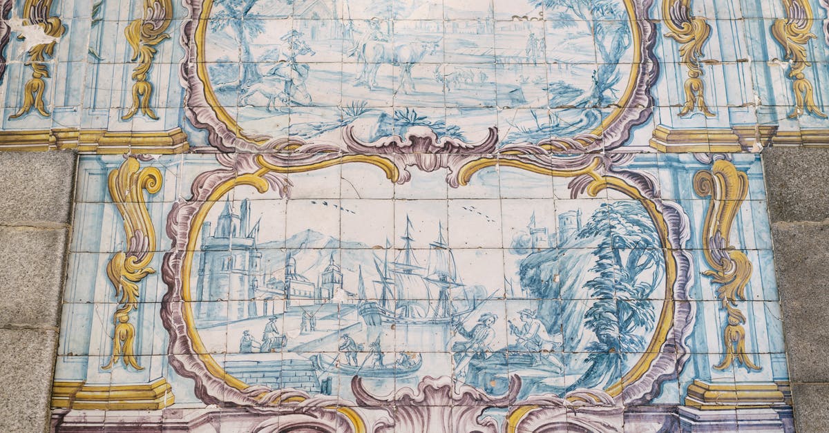 Can I build all ideology wonders in my original capital in Civilization 5? - Amazing Azulejo tin glazed ceramic tilework depicting pastoral scene and ship in port on wall of building in Porto city in Portugal
