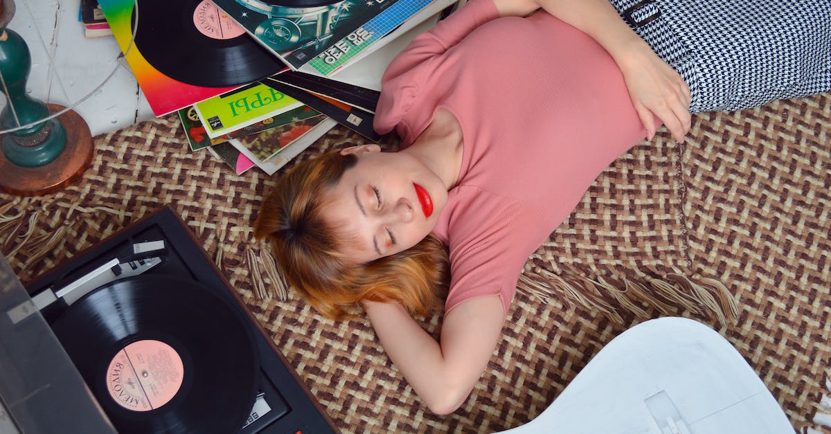 Can I check whether a player is behind a mob? - From above dreamy young female in casual wear lying on floor with eyes closed and hand behind head while listening to vinyl record player Can I check whether a player is behind a mob? - From above dreamy young female in casual wear lying on floor with eyes closed and hand behind head while listening to vinyl record player