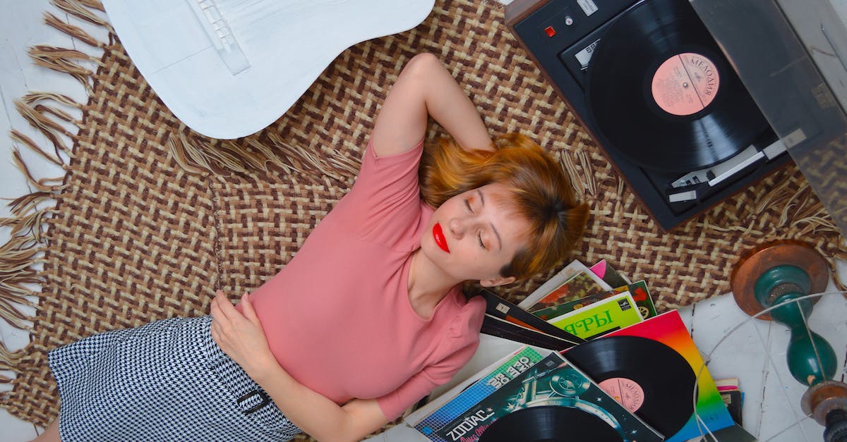 Can I check whether a player is behind a mob? - Top view dreamy young female with red lips wearing casual wear lying on floor with eyes closed and hand behind head and listening to vinyl record player Can I check whether a player is behind a mob? - Top view dreamy young female with red lips wearing casual wear lying on floor with eyes closed and hand behind head and listening to vinyl record player