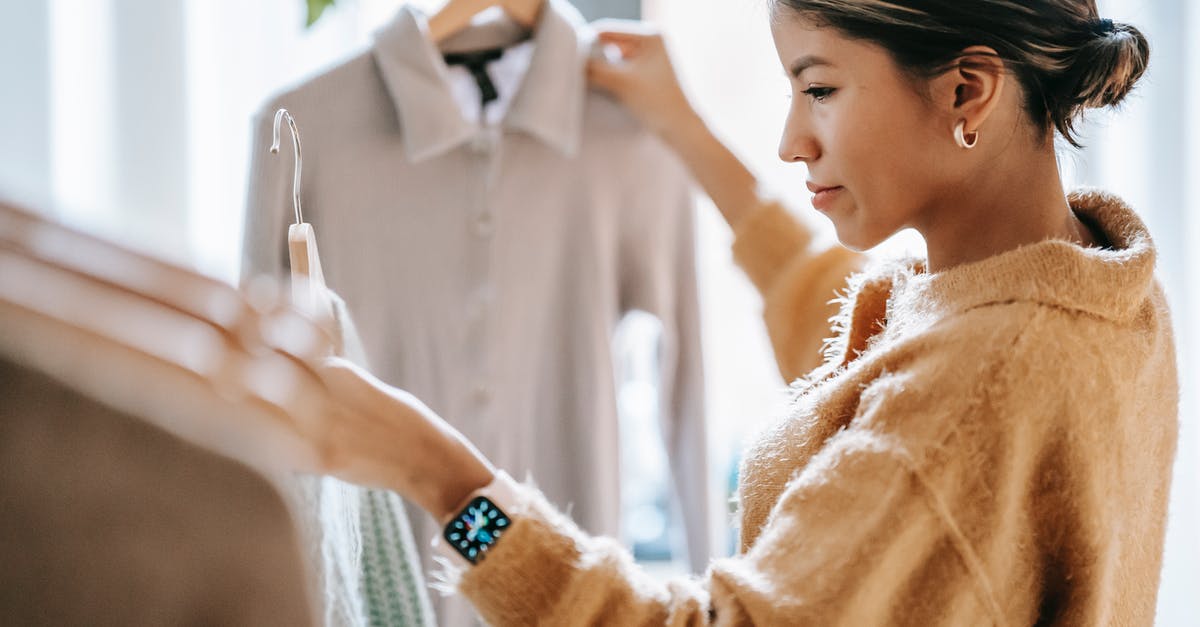 Can I choose only a select amount of video to "share"? - Crop focused ethnic female in casual clothes choosing apparel while standing near rack in boutique Can I choose only a select amount of video to "share"? - Crop focused ethnic female in casual clothes choosing apparel while standing near rack in boutique