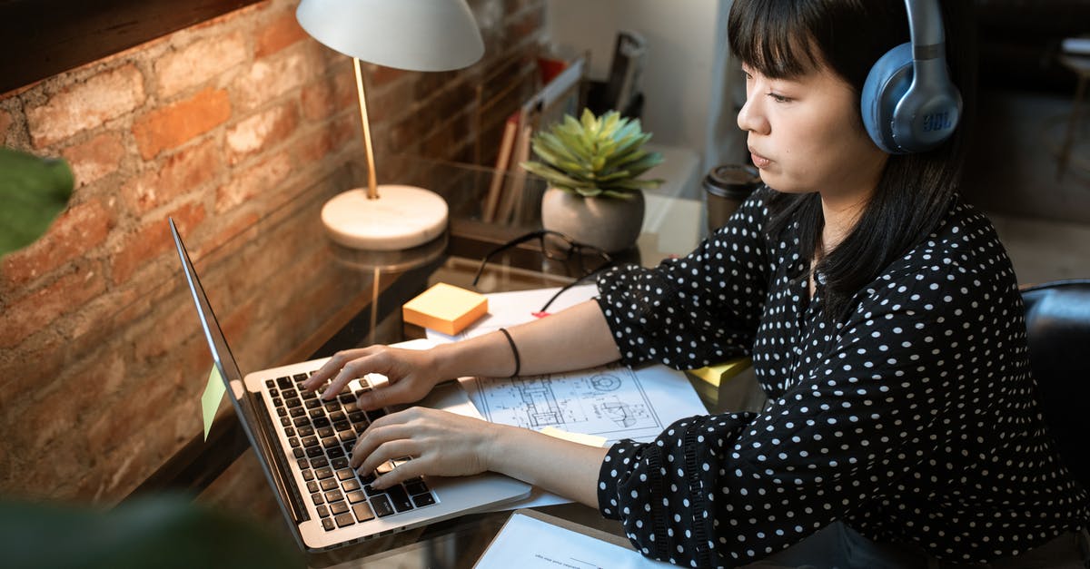 Can I copy my Mass Effect DLC from my PC to my 360? - Woman in Black and White Polka Dot Long Sleeve Shirt Using Macbook Air