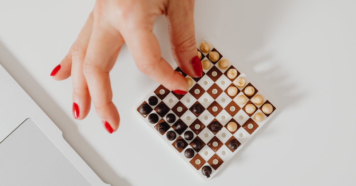 Can I find all mini medals later in the game? - Close-Up Shot of a Person Playing Chess