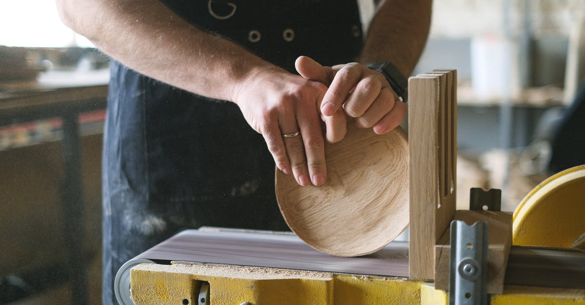 Can I find all the Tetra Master cards in Disc 4? - Unrecognizable male woodworker shaping round wooden detail while working at belt and disc sander in professional workshop on blurred background Can I find all the Tetra Master cards in Disc 4? - Unrecognizable male woodworker shaping round wooden detail while working at belt and disc sander in professional workshop on blurred background