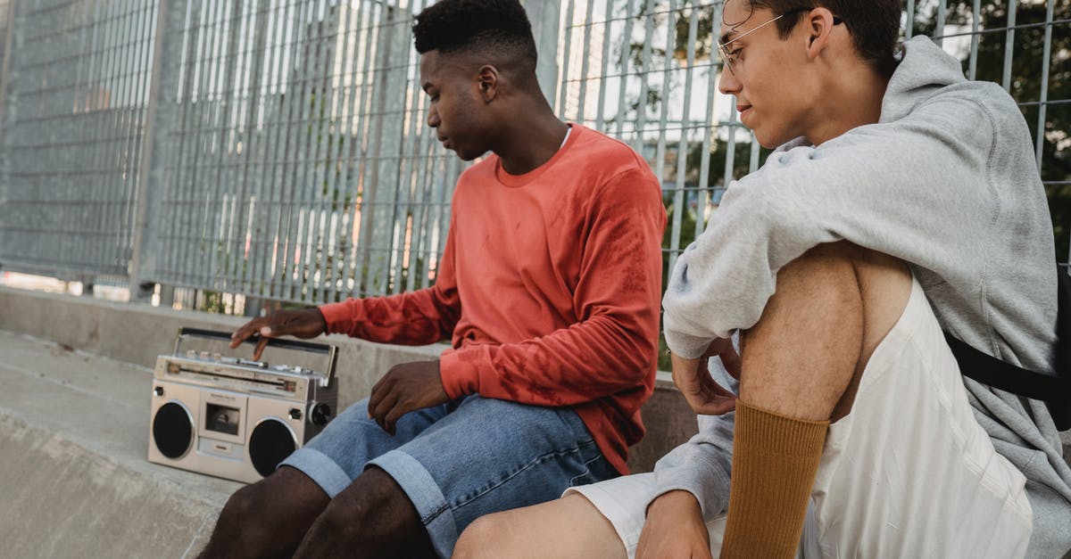 Can I free the radio spokesperson in Just cause 3? - Confident youthful multiracial guys listening to old songs on retro record player Can I free the radio spokesperson in Just cause 3? - Confident youthful multiracial guys listening to old songs on retro record player