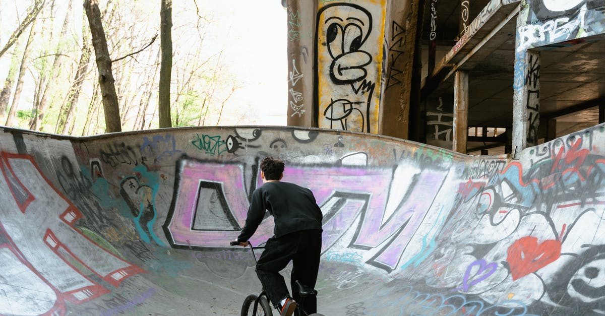 Can I hatch a Pokemon egg by riding a bike [duplicate] - Man in Black Jacket Riding Bicycle on White and Pink Wall Paint