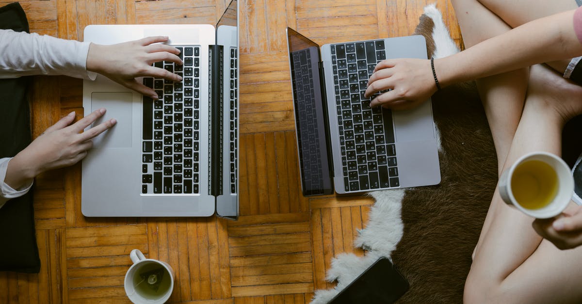 Can I import Pokémon from my Let's Go team into Pokémon Home without the original game? - From above of crop unrecognisable female friends typing while studying on laptops remotely and enjoying tea on floor in cozy living room