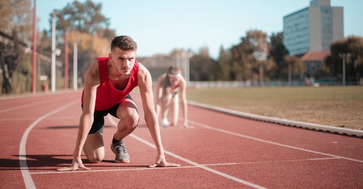 Can I just run away and pretend nothing happened if things start smoldering around me? - Strong sportsmen ready for running on stadium