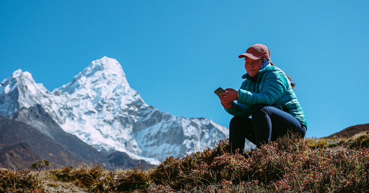 Can I leave some loot in "flashback" to pick up in current timeline? - Tourist Girl Sitting on Mountain Meadow with Phone in Hand