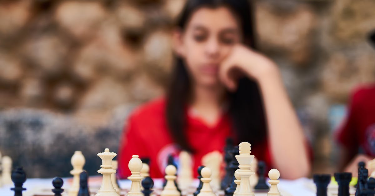 Can I move and redownload the preinstalled Wii U games? - Woman Playing Chess