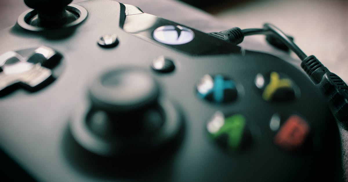Can I play an Xbox One Fifa 17 on an Xbox 360 too? - Closeup Photography Xbox One Black Controller