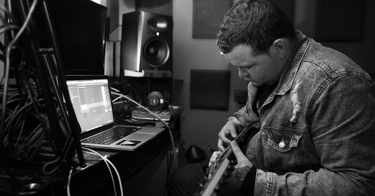 Can I play GameCube audio through my mac computer or headphones? - Concentrated musician playing guitar in studio Can I play GameCube audio through my mac computer or headphones? - Concentrated musician playing guitar in studio