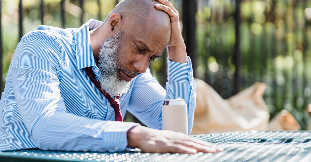 Can I put the custom content on an external drive? - Thoughtful black man sitting at table in veranda Can I put the custom content on an external drive? - Thoughtful black man sitting at table in veranda