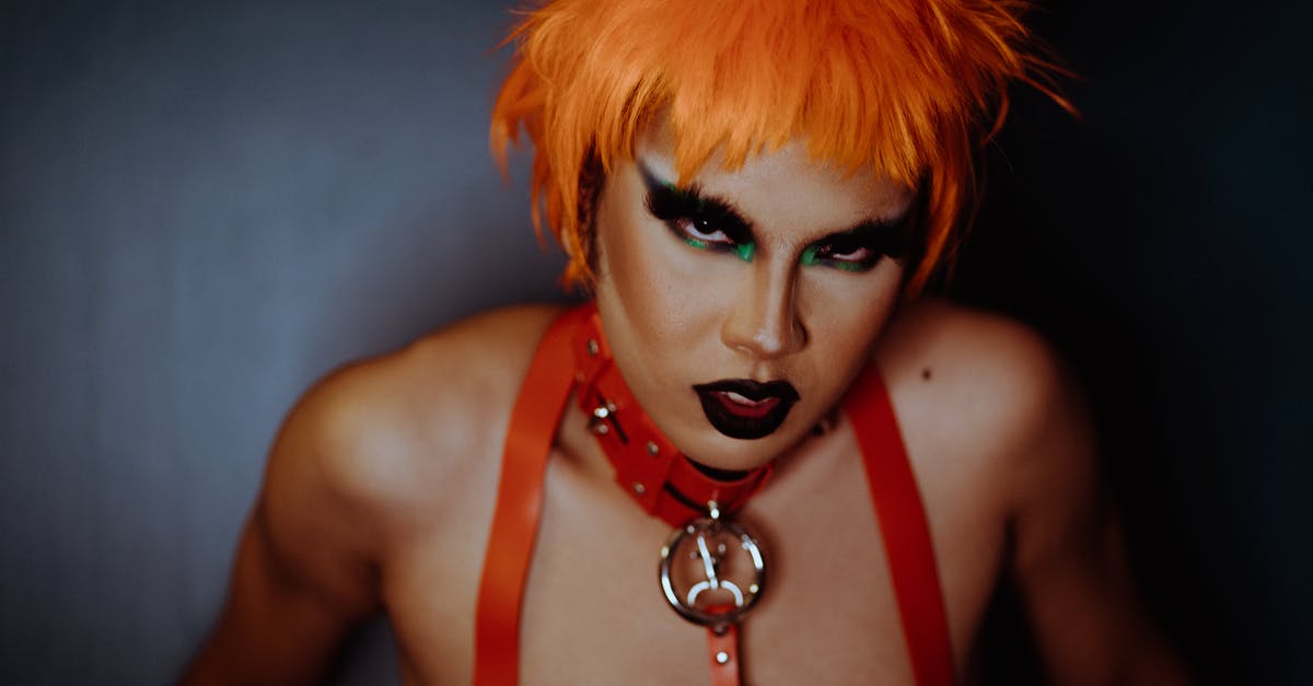 Can I remove some of the strange attributes from a strange cosmetic? - Eccentric woman with dark makeup and dyed orange hair