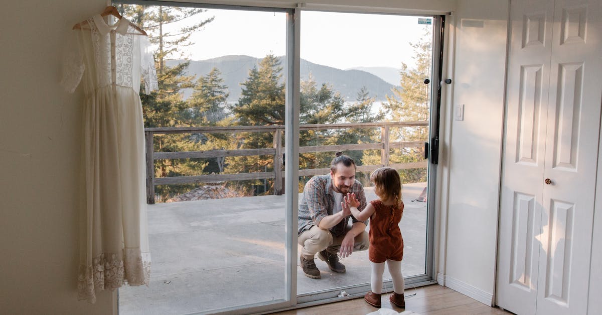 Can I revert to the original play through after starting the second? - Dad and daughter touching with palms to each other through glass