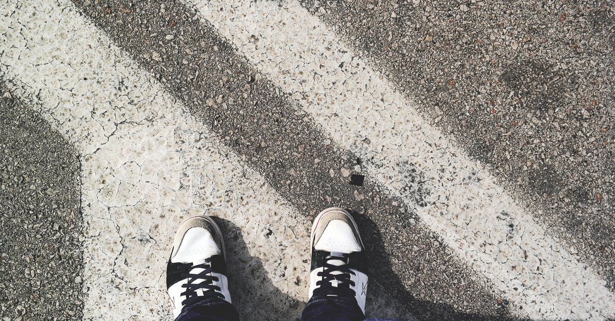 Can I safely wait before starting a mission? - Man in White and Black Sneakers Standing Outdoor during Daytime Can I safely wait before starting a mission? - Man in White and Black Sneakers Standing Outdoor during Daytime