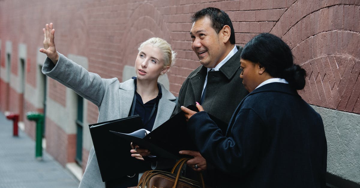 Can I save epic project points while im not building an epic project? - Young businesswoman explaining project to ethnic partners Can I save epic project points while im not building an epic project? - Young businesswoman explaining project to ethnic partners