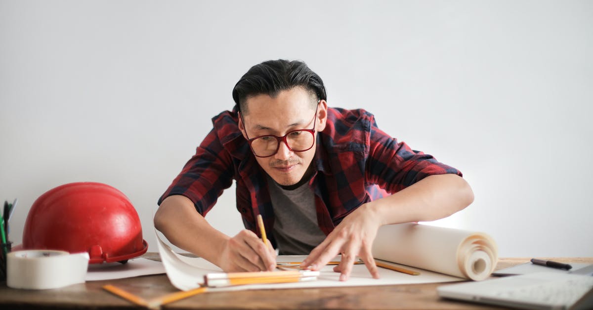 Can I still create new households after starting the game? - Inspired young male engineer in glasses drawing draft on paper bending over table against white wall Can I still create new households after starting the game? - Inspired young male engineer in glasses drawing draft on paper bending over table against white wall