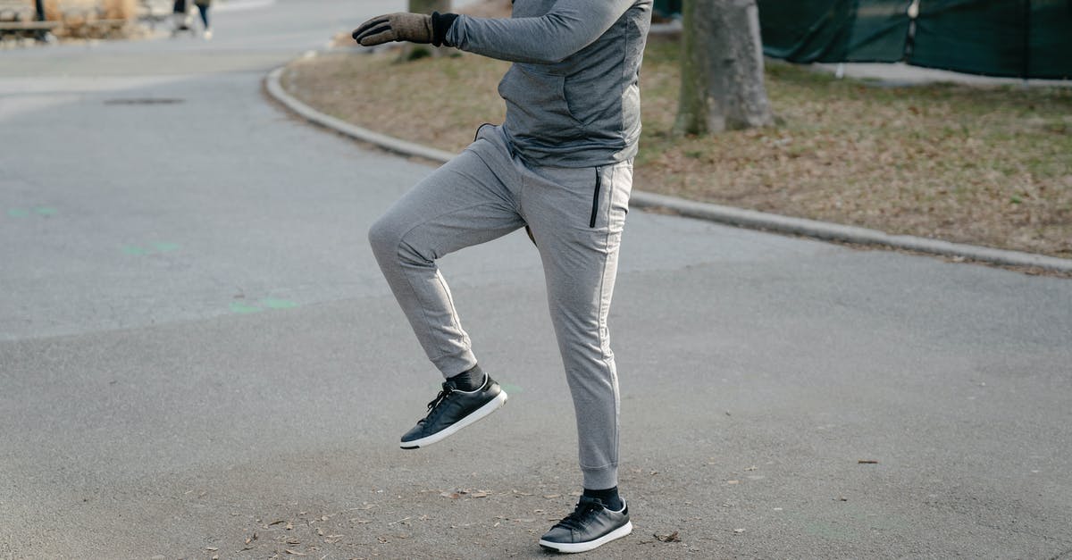 Can I still get the path rewards if I own physical copies of both games? - Unrecognizable man warming up on street