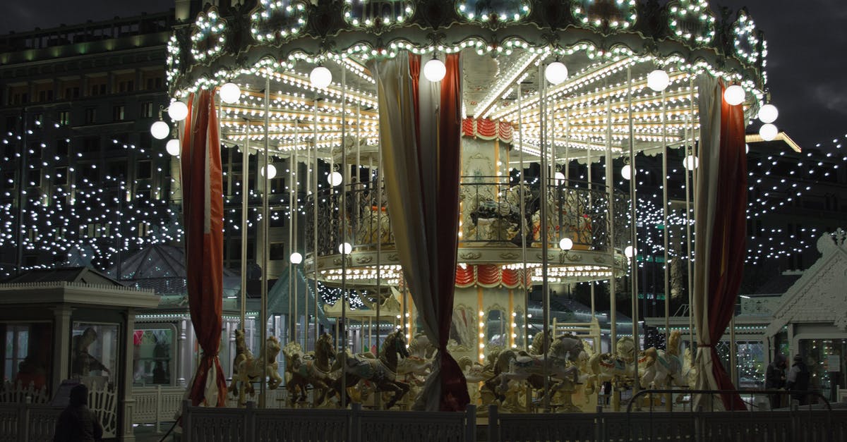 Can I still play LoL even if I switched country? - Illuminated merry go round in amusement park at night