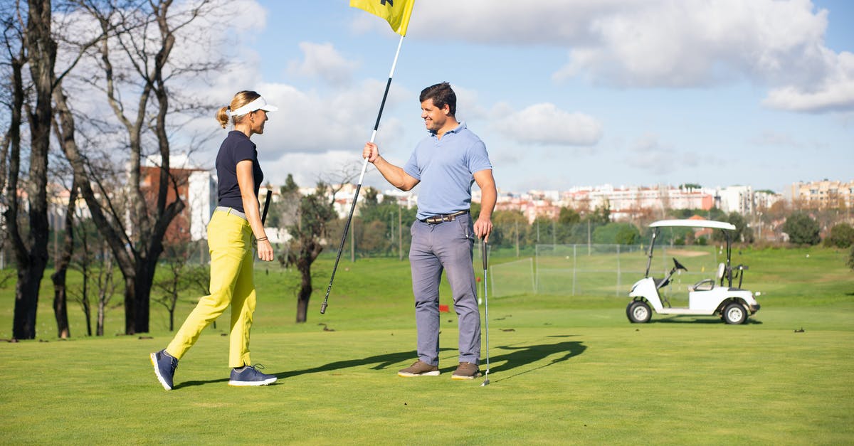 Can I still play on after activating FLAG is END in Baba is You? - A Man and Woman Standing on the Field while Having Conversation