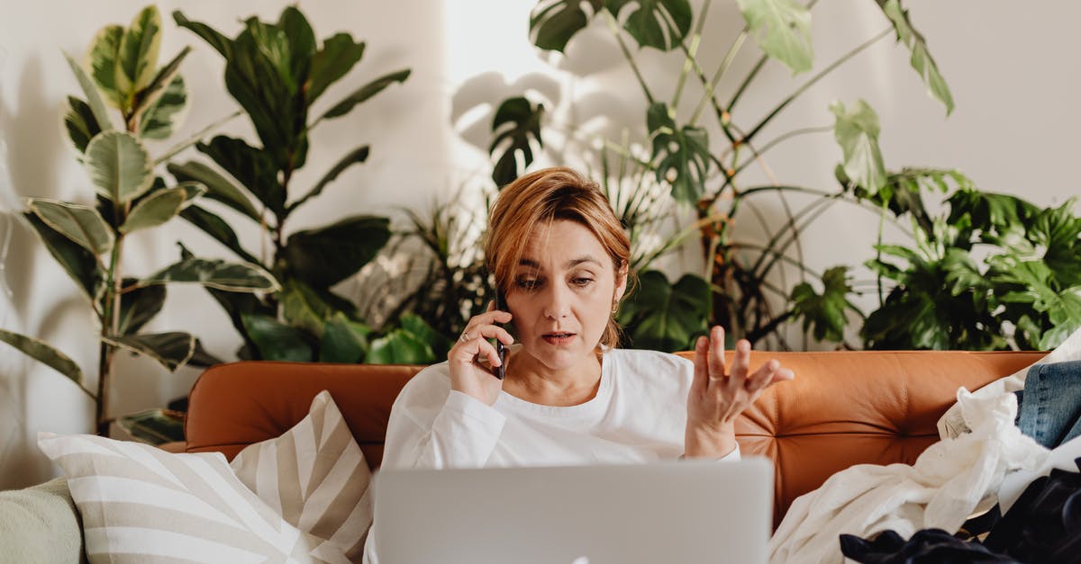 Can I synchronize Plague Inc. mobile version with the PC version? - Woman in White Long Sleeve Shirt Sitting on Brown Couch