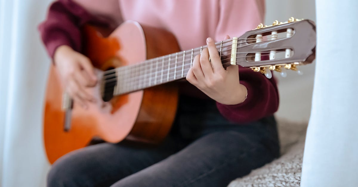 Can I test to see if a player has placed a bed without creating a scoreboard objective? - Faceless skilled female musician playing acoustic guitar while sitting on comfortable bed near white curtains during music performance at home
