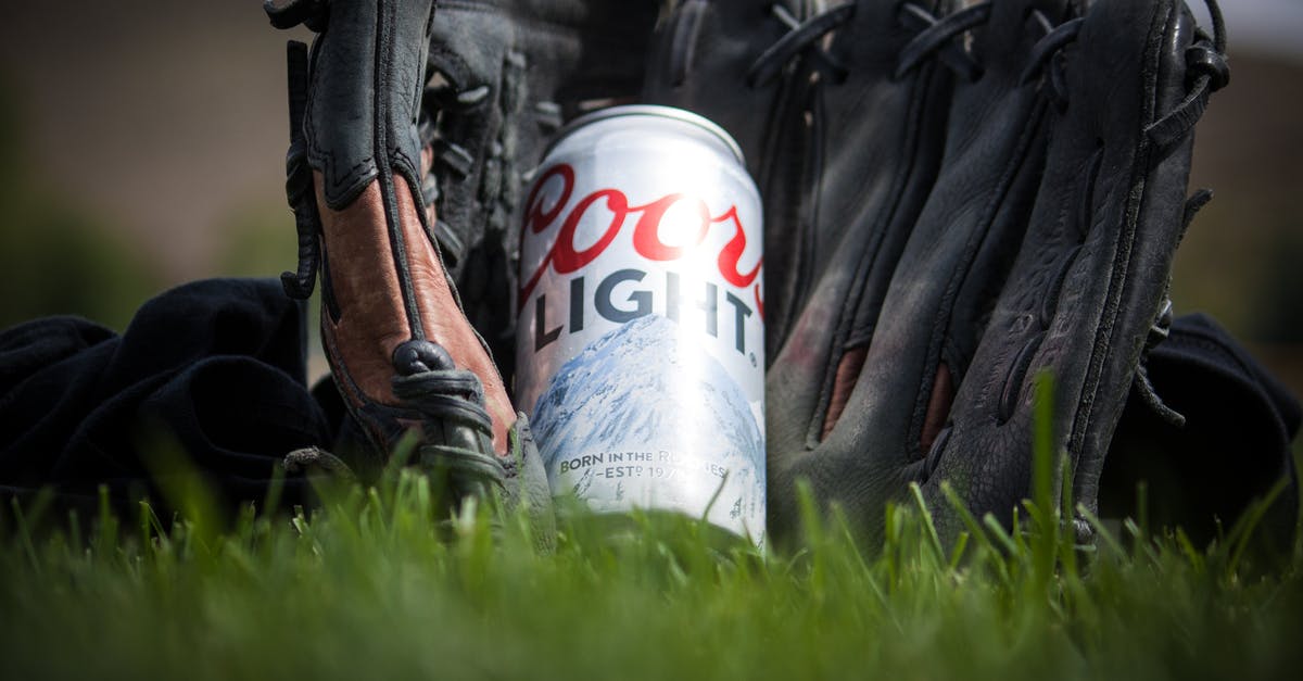 Can I Toggle Grass - Close Up Photography of Coors Light Beer Near Black Baseball Mitts Can I Toggle Grass - Close Up Photography of Coors Light Beer Near Black Baseball Mitts