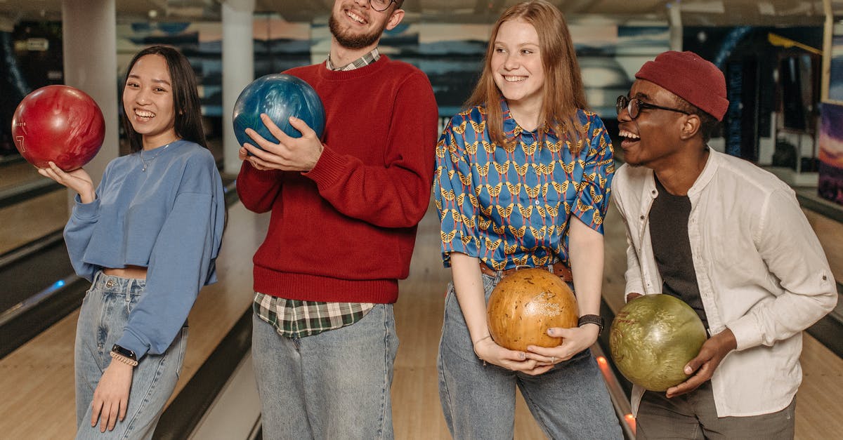 Can I transfer a game from a friends PSN account to mine? [closed] - Close-Up Shot of a Group of Friends Holding Bowling Balls