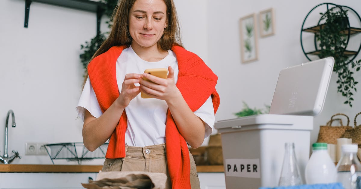 Can I use Pokemon Home to sort my boxes permanently - Cheerful female browsing mobile phone and standing at table with sorted paper and plastic waste