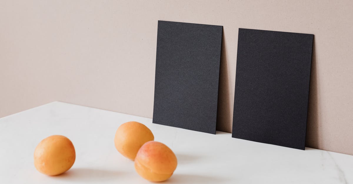 Can I use two different graphic cards together? [closed] - Creative Arrangement of Two Black Cardboard Cards and Ripe Apricots