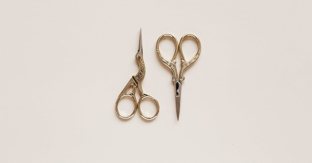 Can I use Xbox live gold from a different account onto another? - Top view composition of scissors of various shape with carved ornament on beige table