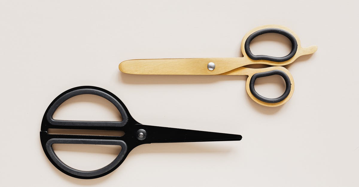 Can I use Xbox live gold from a different account onto another? - Top view of multicolored scissors of different shape on beige table