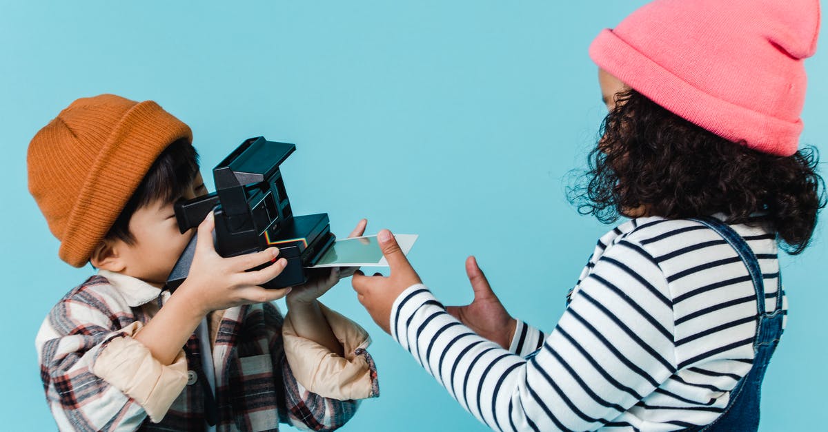 Can I view a memory before the Captured Memories Quest? - Multiracial children taking photo on retro instant photo camera