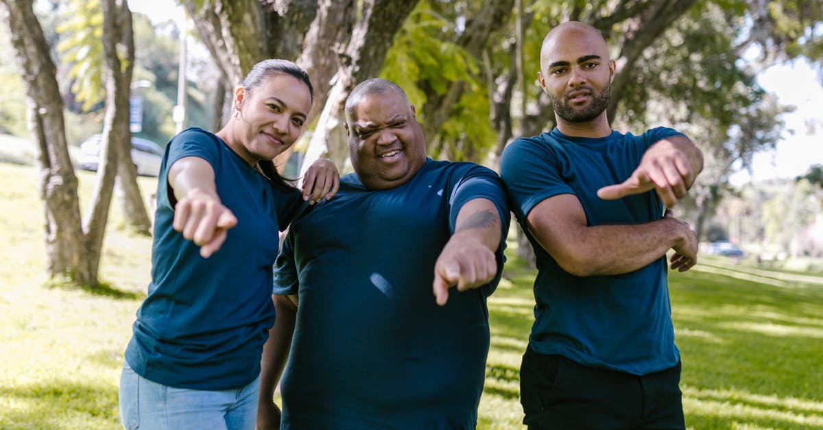 Can I win a culture victory after I win a science victory? - Man in Blue Crew Neck T-shirt Standing Beside Woman in Blue Crew Neck T-shirt
